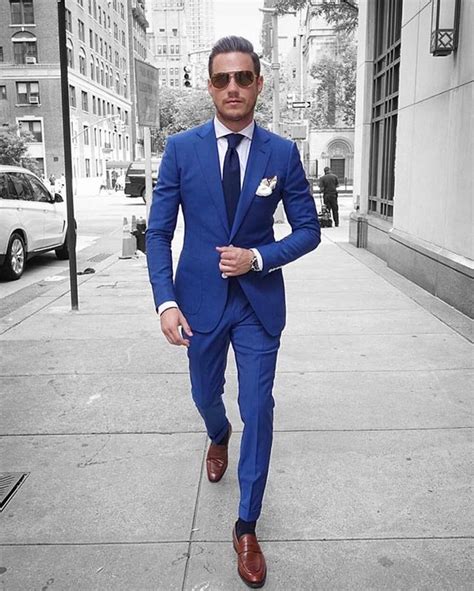 men's blue suit with brown shoes.